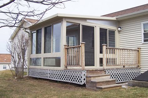 This cute sunroom on a small ranch home features extra glass under the roof for added light and height. Home Sunroom, Sunroom Additions, Mobile Home Addition, Small Sunroom, Kitchen Bar Design, Three Season Porch, 4 Season Room, Four Seasons Room, Sunroom Furniture