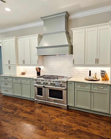 24 Stylish Top Kitchen Cabinet Ideas You’ll Adore Sage Green Lower Cabinets, White Upper Cabinets Dark Lower, Green Lower Cabinets, Gray Herringbone Backsplash, Dark Wood Flooring, White Upper Cabinets, Top Kitchen Cabinets, Lower Cabinets, Kitchen Cabinet Ideas