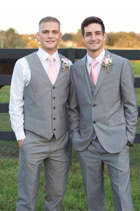 Grey Pants And Vest Outfit Men, Grey Tux Pink Tie, Gray And Pink Tuxedo, Pink And Grey Groomsmen Attire, Groom And Groomsmen Attire Grey Blush Pink, Gray Suit Pink Tie, Chambelanes Outfits Pink, Blush Groomsmen Attire, Pink Groomsmen Attire