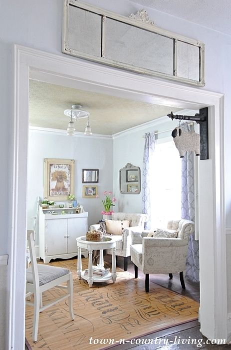 Hang a mirror above a doorway to mimic a transom window Mirror Over Doorway, Mirror Above Doorway, Above Doorway Decor Living Room, Above Doorway Decor, Farmhouse Sitting Room, Receiving Room, Doorway Ideas, Hall Door, Doorway Decor