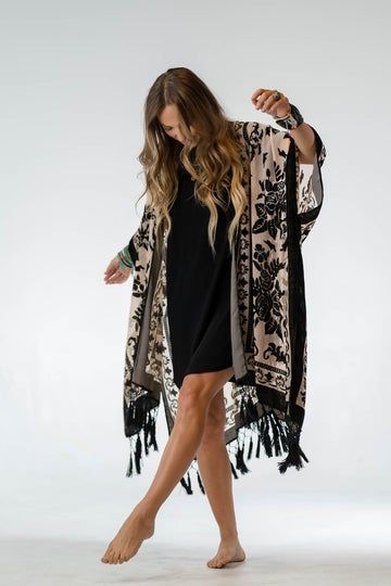 Women's boho clothing and jewelry. Create your chic bohemian outfit from our curated selection of boho dresses, tops, bell-bottoms, and accessories. Black Dress With Kimono, Velvet Kimono Outfit, Velvet Fringe Kimono, Ruffled Denim Jacket, Dress With Kimono, Petite Height, Kimono Outfit, Three Bird Nest, Velvet Kimono