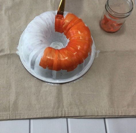 This is a fun project where you take a vintage bundt pan and give it a new life by making it into a pumpkin fall wreath. This is a simple DIY project with only 8 easy steps.    Repurposing vintage items is so exciting! The ridges on this bundt pan reminded us of the shape of a pumpkin. That is how we came up with the idea of this fall wreath.  Here are the things you need to gather together before starting this project:         Vintage Bundt Pan  TSP Cleaning Solution  Old Cloth  Glov… Bundt Cake Pans Repurposed, Bundt Cake Pan Pumpkin Craft, Bundt Pan Crafts Ideas, Bunt Pan Pumpkin Craft, Bundt Pan Pumpkin Craft, Bundt Pan Pumpkin, Pumpkin Fall Wreath, Pumpkin Wreath Diy, Pumpkin Bundt