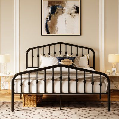 Farmhouse flair. This platform bed showcases vintage-inspired spindle accents and clean lines for a cozy, clean-lined look in your bedroom. The simple frame is crafted from metal with a matte black finish for a versatile design that complements a variety of color palettes. Both the headboard and footboard feature an arched silhouette that keeps pillows and blankets in place. This bed frame has center legs that provide additional support. We also love that the slat system does not require a box s Black Metal Bed Frame, Scandi Bedroom, Black Metal Bed, Farmhouse Flair, Bedroom Stuff, Iron Bed Frame, Bed Platform, Simple Frame, Rental Apartment