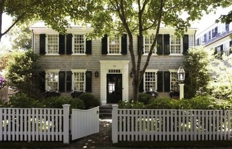 gray colonial house with black shutters and white picket fence, Gardenista Colonial Curb Appeal, House With Black Shutters, Black And White House Exterior, Shingle House, White Exterior Houses, Colonial Homes, Black Shutters, Colonial Exterior, Casas Coloniales