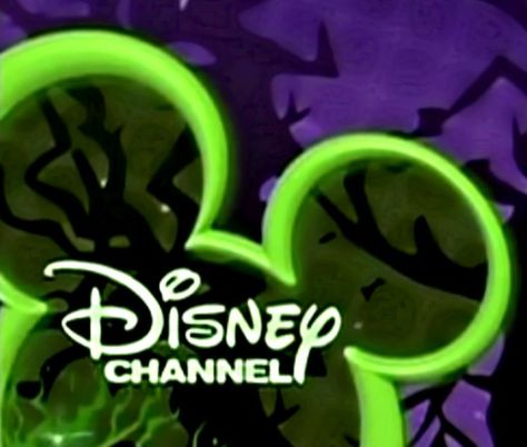 The Disney Channel logo dresses up in green and purple for Halloween fun! Disney Halloween 2000s, Halloween 1990 Aesthetic, Monstober Disney Channel, Halloween Aesthetic 90s, 2010s Halloween, 200s Halloween, Monstober Disney Channel Aesthetic, Disney Monstober, Disney Channel Halloween Aesthetic