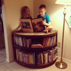 Upcycled Cable Spool / Reel - this one was cut to fit into a corner Shop Wheels, Wire Spool Ideas, Bookcase Inspiration, Cable Spool Tables, Wooden Cable Spools, Spool Projects, Cable Spools, Spool Ideas, Spool Furniture