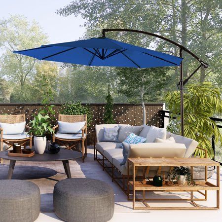 Sit comfortably under the sun with these Royal Blue 10 Ft Patio Offset Cantilever Umbrellas. Weather resistant polyester canopy provide a nice outdoor shade for your patio & Garden lounge area. Ideal for placing next to your favorite poolside chair or outdoor furniture. Easily props up when needed with an easy to crank lift mechanism and turn open canopy. Made with durable steel ribs and sturdy cross brace that can easily be weighted down with any universal umbrella base weights of your choi Large Umbrella For Patio, Garden Lounge Area, Outdoor Parasol Patio Umbrellas, Oversized Umbrella For Patio, Adjustable Outdoor Umbrellas For Rainy Season, Poolside Chairs, Outdoor Patio Shades, Turquoise Bedding, Patio Sun Shades