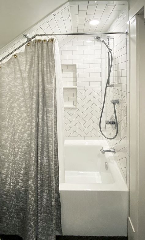 White Subway Tile and Tub, Tile Pattern with sloped ceiling, sloped shower curtain rod, Chrome Fixtures with Brass Accents Slope Ceiling Shower Ideas, Tub Shower Combo Slanted Ceiling, Sloped Shower Curtain, Slanted Wall Shower Angled Ceilings, Tub Shower Combo Sloped Ceiling, Slant Ceiling Shower Curtain, Angled Ceiling Shower Curtain, Shower Curtain For Slanted Ceiling, Slanted Shower Curtain Rod