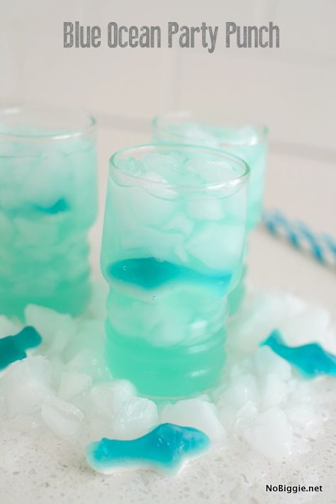 Serve up this Blue Ocean Party punch at your next party! We are making Blue Ocean Party Punch and floats! Here's the ingredient lineup: Blue Hawaiian punch, Sprite and pineapple juice. Don't forget some gummy candy sharks, striped straws and lots of ice! Just fill your glass 1/3 full with the blue Hawaiian Punch, along with just a small pour of Sprite to add some carbonation and the pineapple juice to add a little tropical flavor. I love how the pineapple juice changes the color to more of a tur Recipes Kids Love, Not Ready To Say Goodbye, Blue Hawaiian Punch, Ocean Food, Meals Kids Love, Summer Punch, Birthday Party Drinks, Fun Summer Drinks, Ocean Birthday Party