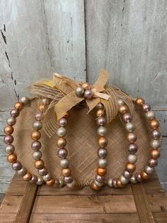 Wood Bead Pumpkin Wreath, Beaded Wire Pumpkin Wreath, Fall Garland Dollar Tree, Pumpkin Frame Craft, Beaded Pumpkin Wreath, Dollar Tree Wire Pumpkin Frame, Pumpkin Wire Wreath Form Dollar Tree, Dollar Store Pumpkin Wreath, Crafting With The Shabby Tree