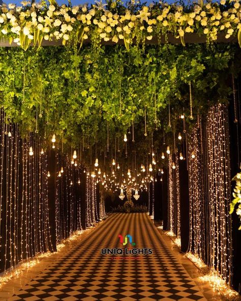 Naushad Khan on Instagram: "Taking our guests on a fairytale ✨ experience as they step into a pathway overflowing with hundreds of sparkly fairy-lights ✨✨✨✨✨ : : Light designing by: @uniq_lights : : Visit us: www.uniqlights.com : Facebook : Uniq lights You tube : Uniq lights Email@: info@uniqlights.com : : : : #wedding #bride #love #weddingphotography #uniqlights #weddingday #weddinginspiration #photography #fashion #weddingplanner #makeup #bridetobe #bridal #prewedding #weddingphotographer #w Light Decoration For Wedding, Lights Entrance Wedding, Lighted Pathway Wedding, Photobooth Ideas For Wedding Receptions, Lawn Stage Decoration, Fairy Lights Entrance Decor Wedding, Outside Indian Wedding, Wedding Tunnel Entrance Fairy Lights, Wedding Lights Decorations