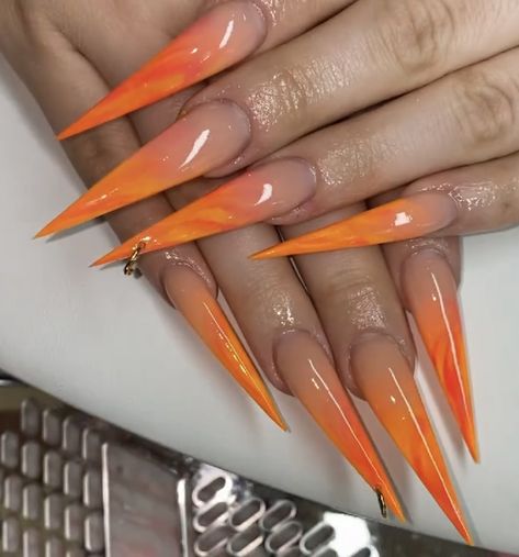 Slitetto Nails, Orange Stilleto Nails Long, Steletoes Nails Long, Long Sharp Acrylic Nails, Stelitto Nails Ideas, Orange Stiletto Nails Designs, Orange Nails Stiletto, Staleto Nails Long Design, Coffin And Stiletto Nails Together