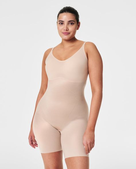 From our groundbreaking shapewear collection, this Invisible Shaping bodysuit is crafted with single-layer Printed Power® shaping technology, providing lightweight yet powerful support. Enhance your silhouette with a fit-flexible bust, smoothing back and free-cut hems. The bodysuit also features adjustable straps and an open gusset for easy access when nature calls. | Spanx Women's SPANXshape Invisible Mid-Thigh Bodysuit Thigh Chafing, Shapewear Bodysuit, Body Shapers, Women's Shapewear, Wearing Dress, Shapewear, Breathable Fabric, Comfort Fit, One Piece