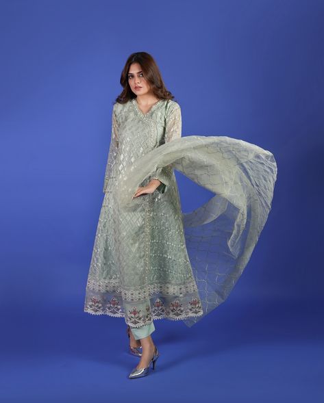 Opulent - Pastel Green 💚 This exquisite 3-piece stitched Angrakha set is crafted from luxurious embroidered organza, offering a timeless blend of elegance and tradition. Paired with a matching organza dupatta that flows effortlessly, this ensemble radiates grace and charm. Whether for festive occasions or formal gatherings, this Angrakha is designed to make a statement with its refined aesthetic and impeccable craftsmanship. Fabric Details: Shirt & Dupatta: Organza Trousers & Lining: Silk ... Organza Trousers, Green Dupatta, Refined Aesthetic, Embroidered Organza, Organza Dupatta, Pastel Green, Festival Party, Party Wear, 3 Piece