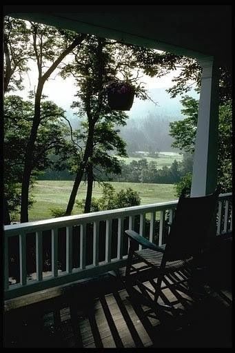 Overlooking the farm. What a stunning view from this porch. Love the balustrade too. Porch Life, Peaceful Places, Rocking Chairs, Decks And Porches, Jolie Photo, Green Gables, Porch Patio, Country Life, Farm Life