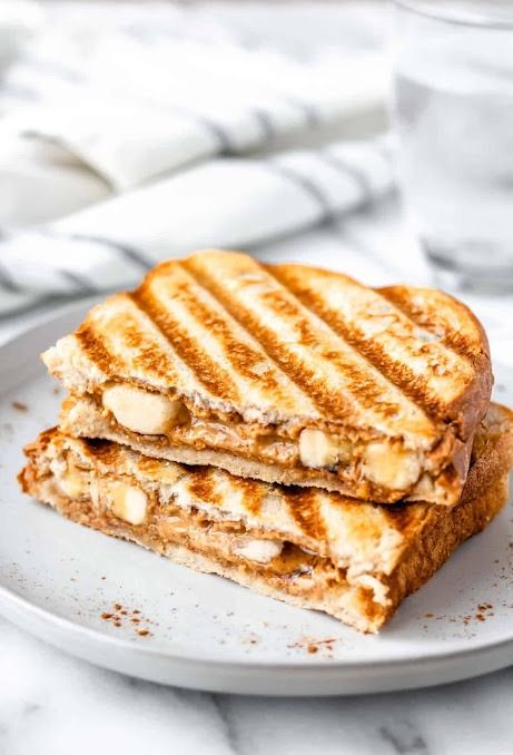 Embark on a delightful culinary journey with the Honey Banana Grilled Cheese Sandwich—a creation that seamlessly blends the natural sweetness of ripe bananas with the golden richness of honey and the comforting warmth of melted cheese. This sweet and savory fusion transforms the classic grilled cheese into a deliciously unique experience. In this article, we'll guide you through the simple steps to craft this delectable Honey Banana Grilled Cheese Sandwich that's sure to become a delightful addi Cream Cheese Grilled Cheese, Banana Grilled Cheese, Cucumber Tea, Magnolia Bakery Banana Pudding, Cucumber Tea Sandwiches, Grilled Sandwiches, Banana Cream Pie Recipe, Banana Treats, Peanut Butter And Banana