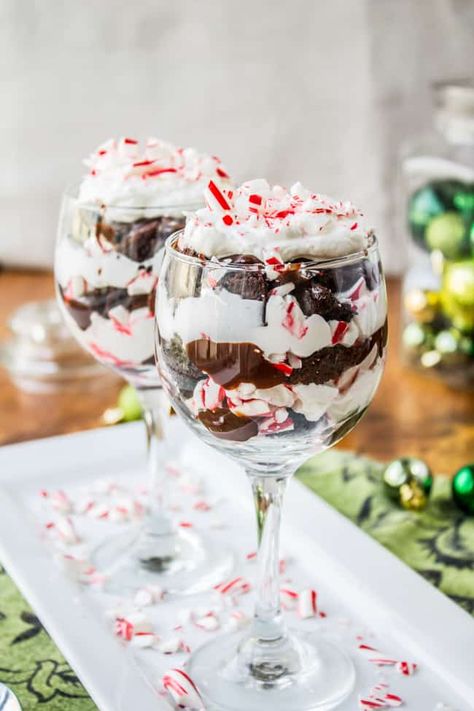 Candy Cane Brownie Trifle Recipe from The Food Charlatan. This rich Brownie Trifle recipe is an impressive dessert to serve after Christmas dinner. You can't get more decadent than brownies topped with Chocolate Peppermint Sauce and whipped cream. It's one of my favorite holiday desserts. I make it every year! #trifle #christmas #candycane #peppermint #chocolate #whippedcream #dessert #brownie #pudding Brownie Trifle Recipe, Trifle Recipes Easy, Dessert Holiday, Christmas Trifle, Brownie Trifle, Favorite Holiday Desserts, Desserts Christmas, Impressive Desserts, Christmas Eve Dinner