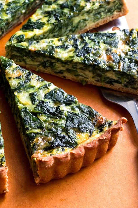 NYT Cooking: This is a classic combination for a quiche, but it’s lighter, with <a href="http://cooking.nytimes.com/recipes/1016715-whole-wheat-yeasted-olive-oil-pastry">a whole-wheat and olive oil crust</a>. If you don't have the time to make the crust, store bought will work just fine. Pizza Roll, Plats Healthy, Onion Tart, Spinach Pie, Fine Cooking, Savory Tart, Nyt Cooking, Tart Recipe, Recipes Crockpot