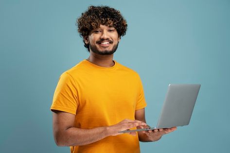 Smiling indian man holding laptop comput... | Premium Photo #Freepik #photo #computer-learning #computer-education #student-work #learning-development Someone Working On Laptop, Student With Laptop, Man Engineer, Man With Laptop, Computer Student, Student Job, Picture Of A Person, Team Photoshoot, Student Images