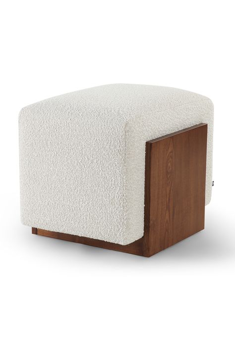 This luxurious midcentury revival has plush upholstery made of bouclé fabric in a sand color. Its solid wood base in classic brown color, which is cleverly proportioned, completes the opulent appearance. If you wish to bring an earthiness to a room, the Warwick stool is a must. W22 x D17 x H18 in | Weight 22lbs W56 x D44 x H46 cm | Weight 10kgs Upholstery | Bouclé white Base | Solid ash wood Puff Chair Living Rooms, Ottoman Stool Living Room, Poufs In Living Room, Pouffe Living Room, Stool Living Room, Fabric Sofa Design, Puff Design, Bedroom Stools, White Stool