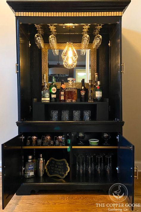 This tutorial walks you through how to take a dated armoire and repurpose it into a home bar, complete with a swag pendent light, storage, and wine glass racks.   DIY Projects | Armoire Makeover | Painted Furniture | Upcyling | Repurposed | Art Deco Style | Art Deco Furniture | Black and Gold Furniture | Painting Furniture |  #howtopaintfurniture #furnitureflip #artdecofurniture #furnituremakeover #armoirebar #armoiremakeover #repurposedarmoire Art Deco Home Bar, Art Deco Armoire, Dining Room Furniture Makeover, Art Deco Bar Cabinet, Armoire Repurpose, Diy Art Deco, Art Deco Buffet, Armoire Bar, Armoire Makeover