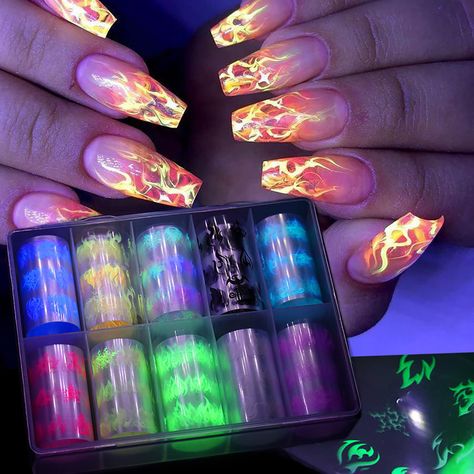 PRICES MAY VARY. 🔥【Package Content】10 rolls flame nail art transfer foil stickers set with a storage box. 1.57inchs*39.4inchs (4*100cm). Bigger size and more attractive design. 🔥【Fluorescent Neon Flame】 The foil nail wraps is designed with fluorescent neon flame pattern, glows under UV light, allow you to design your unique nails freely, so it will make your nails more dazzling and charming.(It doesn't GLOW IN THE DARK, but rather GLOW UNDER UV LIGHT. ) 🔥【Easy To Apply】： Press the foil sticke Neon Glow Nails, Fluorescent Nails, Flame Nail Art, Autumn Nail Art, Neon Nail Art, Neon Nail Designs, Gel Nail Ideas, Fall Acrylic, Negative Space Nails