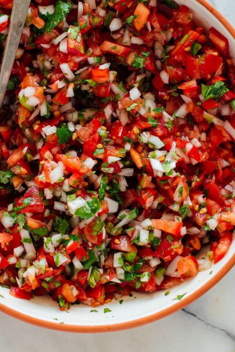 Learn how to make CLASSIC PICO DE GALLO with this easy recipe! You'll need just a few basic ingredients to make this fresh and healthy Mexican recipe—ripe tomatoes, onion, cilantro, jalapeño and lime! Pico de gallo, like salsa, is awesome on tacos, burritos and burrito bowls, nachos, and quesadillas, and makes a great dip, too. Savoury Sauces, Beach Snacks, Healthy Mexican Recipes, Strawberry Salsa, Mexican Recipe, Tacos Burritos, Healthy Mexican, Burrito Bowls, Mexican Christmas