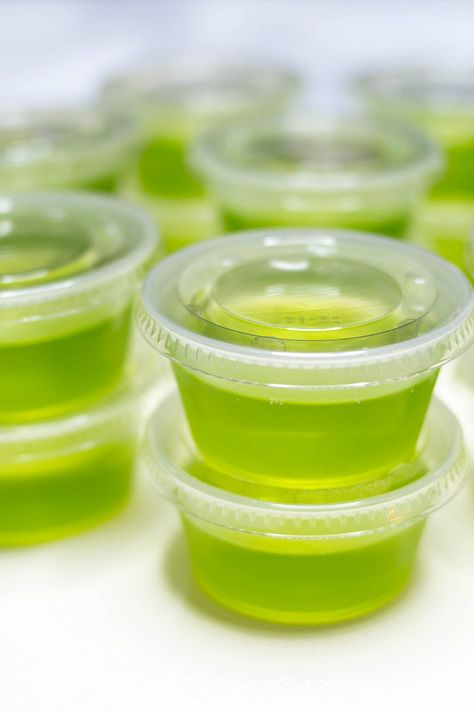 Made with Jolly Rancher apple gelatin and Fireball whiskey, these green apple cinnamon jello shots are awesome! They taste just like boozy apple pie and are the perfect make-ahead treat for a party. Grape Jello Shots, Party Jello Shots, Jolly Rancher Apples, Fireball Jello Shots, Candy Corn Jello Shots, Cider Alcohol, Best Jello Shots, Jello Shots Recipe, Halloween Jello Shots