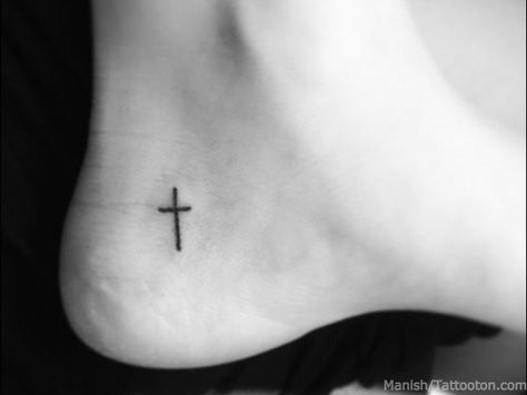 Aside from the more classic angel or praying hands, the wearing of religious symbolism on one’s body has long been a way to express faith, individuality, and identity. Ankle Tattoo Cross, Heel Tattoo, Cross Tattoo Meaning, Small Cross Tattoos, Small Cross Tattoo, Tattoo Foot, Cross Tattoos For Women, Faith Tattoo, Foot Tattoo