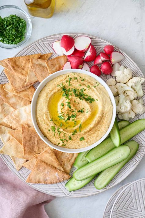 This hummus recipe without tahini skips the sesame, using Greek yogurt instead to create a smooth and creamy homemade hummus. | Hummus Recipe Without Tahini Hummus Recipe Without Tahini, Sweet Potato Hummus Recipe, Roasted Garlic Hummus Recipe, Garlic Hummus Recipe, Potato Hummus, Sweet Potato Hummus, Bean Hummus, Roasted Garlic Hummus, Garlic Hummus