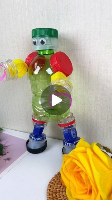 paper crafts creator on Instagram: ""Turn Bottle Caps into a Handmade Robot: A Fun Summer Project" Hashtags:#TurnWasteIntoTreasure #ParentChildHandicraft #HandmadeDIY #WasteUtilization #UpcycledCrafts #EcoFriendlyProjects" Recycle Robot Project Ideas, How To Recycle Plastic Bottles, Robot Project Ideas, Craft With Plastic Bottles, Best Out Of Waste Ideas For Kids, Recycling Projects For School, Bottle Caps Crafts, Handmade Robot, Plastic Bottle Cap Crafts