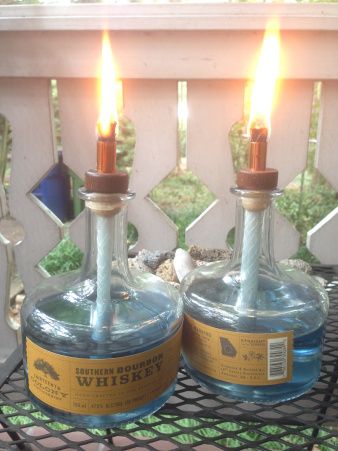 Citronella Whiskey Bottle Candles! Take that you nasty mosquitoes! Whiskey Jug Decor Ideas, What To Do With Old Whiskey Bottles, Upcycle Whiskey Bottles, Whiskey Bottle Lights Diy, Upcycling Whiskey Bottles, Diy Citronella Torch, Bottle Candles Diy, Recycled Whiskey Bottles, Diy Citronella Candles Wine Bottle