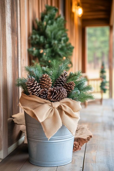 What’s a quick, budget-friendly way to add rustic charm to your cabin? I’d turn a simple metal bucket into a festive decoration with pinecones, twigs, and a burlap ribbon. It’s such an easy DIY project, yet it instantly gives your cabin a cozy, woodsy feel. Don’t you love how simple ideas can make such a big impact? Find more DIY rustic decor projects to try this Christmas! Metal Bucket Decor Ideas, Bucket Decor Ideas, Metal Bucket Decor, Rustic Cabin Christmas, Diy Rustic Christmas, Bucket Decor, Cabin Christmas Decor, Bucket Ideas, Diy Rustic Decor