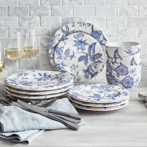 Set an idyllic table with this cream-colored dinnerware set covered in a beautiful blue floral design Crafted in Italy of earthenware, this set is microwave- and dishwasher-safe for easy use and cleanup Set includes four dinner plates, four salad plates and four cereal bowls Only at SLT Blue Dinnerware Sets, Italian Dinnerware, Italian Blue, Lemon Kitchen, White Baby Showers, Blue Dinnerware, Blue Bridal Shower, Elegant Dinner Party, Blue Florals