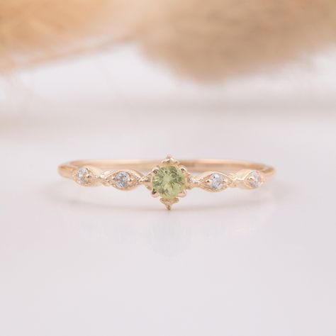 14k yellow gold antique victorian peridot minimalist engagement ring, Delicate & small peridot promise ring for her, Anniversary gift ring WE OFFER UNLIMITED PERIOD INSTALLMENTS PLAN This is a beautiful, stunning, feminine ring that works well for all occasions, styles, and ages. You will love it! Ring information: Main stone: Peridot Approximate size: 2.5mm (1 stone) Accent stones: White cubic zirconia Approximate size: 1.25mm (4 stones) Approximate width of Band 1.0mm Metal type: Gold Metal st Engagement Ring Peridot, Engagement Rings Peridot, Antique Engagement Rings Victorian, Engagement Ring Delicate, Peridot Engagement Ring, Cute Promise Rings, Peridot Engagement Rings, Dainty Engagement Rings, Promise Ring For Her