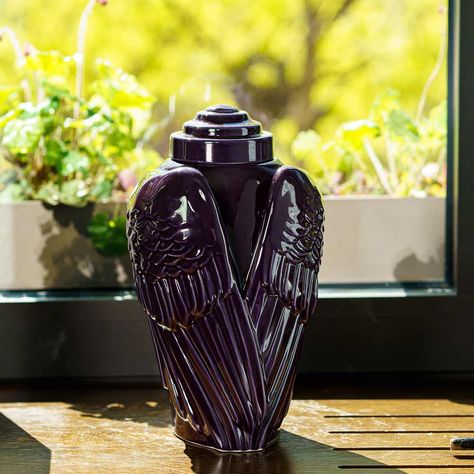 Our Angel Wings urn symbolises divine protection, creating a peaceful memorial to your loved one. Available in an array of different beautiful colours.🤍 #Ceramicurn #Urnsforangels #Designerurns Folded Angel Wings, Purple Angel Wings, Folded Wings, Pet Ashes Jewelry, Purple Angel, Outdoor Urns, Companion Urns, Urn Bracelet, Urns For Ashes