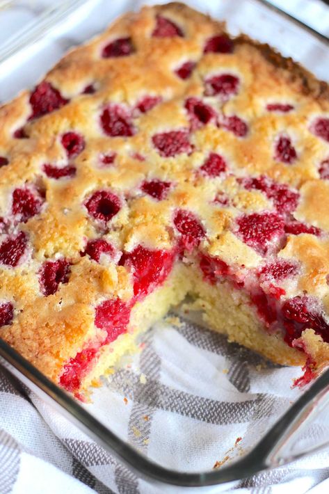 This easy Raspberry Buckle recipe is bursting with fresh berries baked right into a butter batter. Somewhere between a cobbler and a cake, the buckle is an old-fashioned dessert that gets its name from the intended top caused by the berries. Whatever you want to call it, there’s no denying that it’s one delectable treat. Raspberry Cobbler Easy, Raspberry Cobbler Recipe Pioneer Woman, Fresh Rasberry Deserts Easy, Peach And Raspberry Cobbler, Raspberry Buckle Recipe, Pioneer Woman Blackberry Cobbler Recipe, Raspberry Cobbler, Raspberry Whipped Cream, Pan Sizes