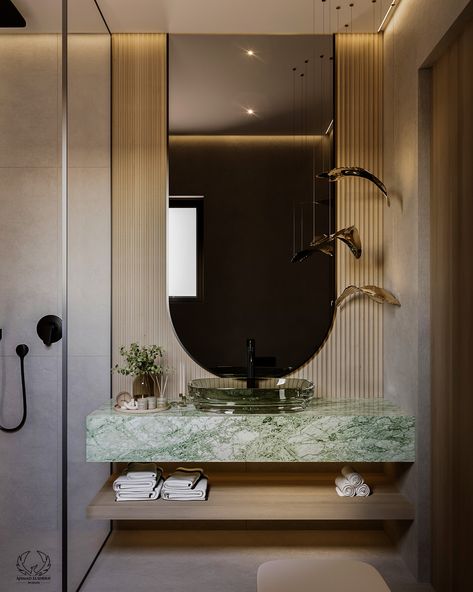 A gorgeous green marble sink table is combined with a sleek light green glass sink for a fresh look. Soft beige walls and eye-catching black fixtures will complete the luxurious look. This elegant mix results in an elegant and luxurious look.

#LuxuryBathroom #ModernElegance #GreenMarble #BlackFixtures #BathroomDesign #bathroomRedesign #homeDecor Dressing Table Bathroom, Green And Beige Bathroom, Glass Sink Bathroom, Light Green Marble, Marble Toilet, Green Marble Bathroom, Marble Sink Bathroom, Sink Table, Marble Bathroom Sink