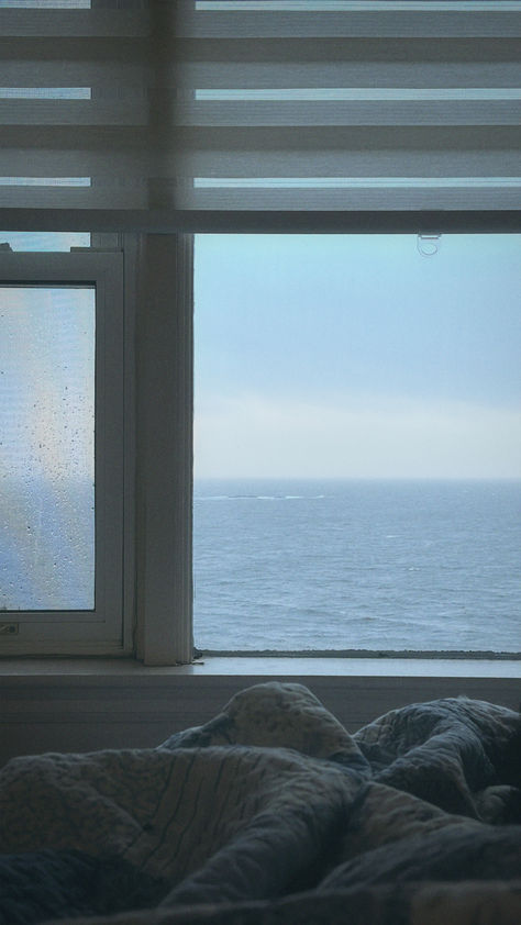 Bedroom view by the sea, cottage wake up, coastal living, beach house design, cottage core, coastal grandma, coastal grandmother, dream life Bedroom By The Sea, Living By The Sea, North Carolina Beach House, Big Glass Windows, Sea View House, Beach View House, Seaside Apartment, Beach House Aesthetic, Cozy Window Seat