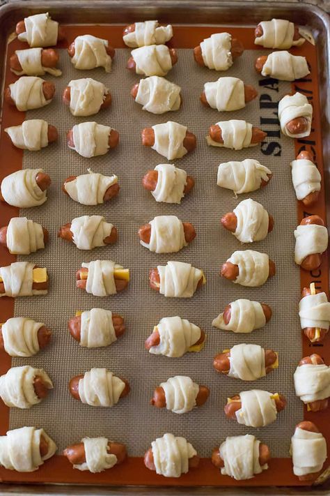 Pigs in a Blanket :: Easy recipe with only two ingredients (three if you want cheese!). Simply wrap mini hot dogs in crescent rolls and bake... Perfect for kids, parties and the Super Bowl! #hotdogs #lilsmokies #crescentdogs #appetizers #snacks #superbowl Pigs In A Blanket Recipe Pillsbury, Piggies In A Blanket, Hot Dog Crescent Rolls, Crescent Dogs, Bridal Brunch Food, Pigs In A Blanket Recipe, Mini Hot Dogs, Kids Recipe, Crescent Roll Recipes