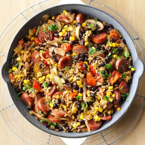 Here's one of my husband's favorite dishes. When it's in season, substitute fresh corn for frozen. Add a dash of cayenne pepper if you like a little heat. —Sheila Gomez, Shawnee, Kansas Kielbasa Skillet, Beans And Vegetables, Kielbasa Recipes, Iron Skillet Recipes, Rice Beans, Skillet Dishes, Cast Iron Skillet Recipes, Skillet Dinners, Cast Iron Recipes