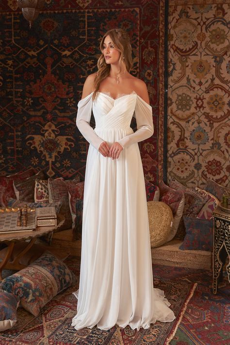 Draw your guests gazes during the procession wearing Lilith, our traditional chiffon and lace A-line gown. Her classic sweetheart neckline shapes her gathered bodice, covered in Chantilly lace for a splash of female elegance. Her Illusion back and cold shoulder sleeves add to the feminine look. Her airy billowing skirt wanes into a stunning chapel train. Boho Vintage Wedding Dress, Frankenstein Wedding, Vintage Wedding Dress Lace, Boho Vintage Wedding, Wedding Dresses Diamonds, Chapel Train Wedding Dress, Chiffon Lace Dress, Vintage Wedding Dress, Wedding Dress Lace