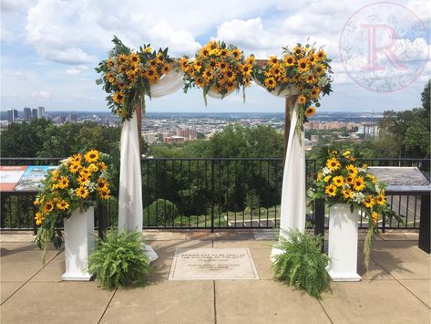 Fall Sunflower wedding arch/arbor flower inspiration in Birmingham at the Vulcan. Sunflower Wedding Altar, Sunflower Wedding Arch Ideas, Sunflower Arch Wedding, Sunflower Arches For Wedding, Sunflower Arch, Sunflower Wedding Arch, Sunflower And Rose Wedding Arch, Wedding Arch Ideas Sunflower, Sunflower Wedding Arbor