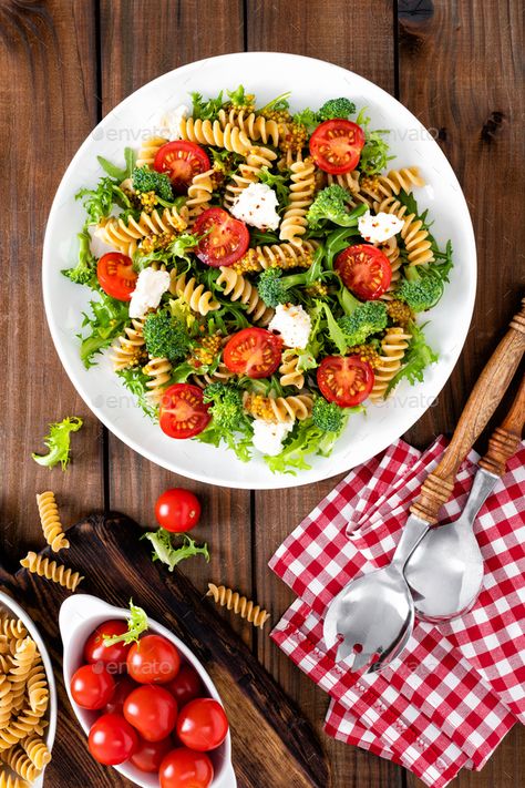 Italian pasta salad with wholegrain fusilli, fresh tomato, cheese, lettuce and broccoli by sea_wave. Italian pasta salad with wholegrain fusilli, fresh tomato, cheese, lettuce and broccoli on wooden rustic background. ...#fusilli, #fresh, #tomato, #wholegrain Salad Lettuce, Tomato Cheese, Italian Pasta Salad, Rustic Background, Pasta Salad Italian, Tomato And Cheese, Sea Wave, Mediterranean Cuisine, Buddha Bowl