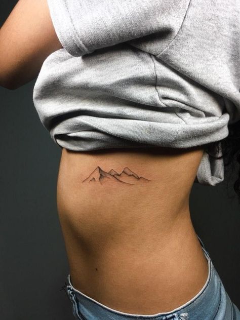 Mountain Tattoo On Ribcage, Mountain Tattoo Collar Bone, Women Mountain Tattoo, Mountain Range Tattoo Simple, Mountain Tattoo Leg, Mountain Tattoo Ribs, Mountain Rib Tattoo, Tattoo Berge, Anchor Tattoo Wrist