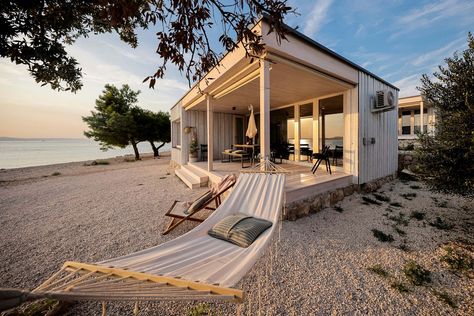 Pack your bags and go glamping in Croatia with this stylish wooden tiny house rental by the beach near Zadar! Book today to avoid disappointment! Beach Tiny House Coastal Cottage, Tiny Beach House Design, Beach Aesthetic House, Small House On The Beach, Tiny Beach House Interior, Small Beach House Interior, Small Beach House, Wooden Beach House, Beach Tiny House