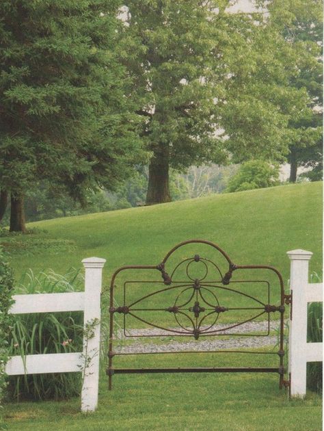 Old Iron Headboard as Gate - sadly, there would critters stuck in there every which way.  Lambs come into this world determined to find out how many things they can get their heads stuck in.  #garden #gate #farm Iron Bedframe, Iron Headboard, Old Headboard, Wrought Iron Bed, Living Pool, Deco Champetre, Iron Bed Frame, White Picket Fence, Have Inspiration