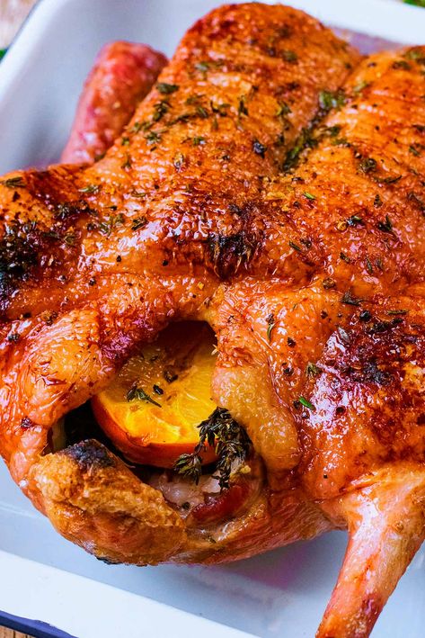 If you are looking for something a little bit different to serve for Christmas dinner or Thanksgiving, then why not try this Honey Roast Duck? Crispy slow roasted duck with a little sweetness from the honey and orange and a hint of thyme. The festive season doesn't have to be all about turkey, and your guests might appreciate the change. A whole duck, oven roasted to perfection - it's easy and healthy. Honey Roasted Duck, How To Roast A Whole Duck, Best Oven Roasted Turkey Recipe, Thanksgiving Duck Recipes, Roast Duck Recipes Christmas, Crockpot Duck Recipes, Christmas Duck Recipes, Roasted Duck Whole, Rotisserie Duck