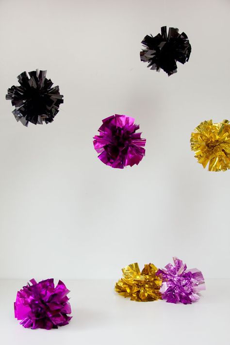 DIY Mylar Fringe Poms  {Studio DIY blog} Pom Pom Keychain Diy, Diy Nye Party, Cheer Gifts Diy, Diy Nye, Nye Party Decorations, Diy Fringe, Diy Foil, Cheer Banquet, Cheerleading Pom Poms