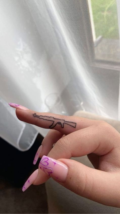 Baddie Tats Hand, Pink Finger Tattoo, Ak Tattoo For Women, Ak47 Nails, Tattoo Ak47, Ak Tattoo, Trap Tattoos For Women, Small Dope Tattoos, Middle Finger Tattoos